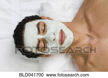 Stock Photography - mixed race man 
receiving spa 
facial treatment. 
fotosearch - search 
stock photos, 
pictures, images, 
and photo clipart