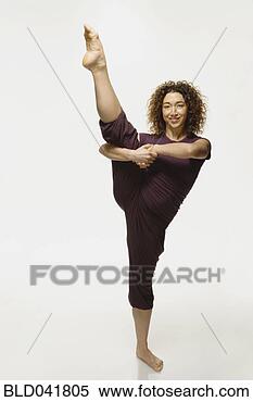 Stock Image - mixed race woman 
practicing yoga. 
fotosearch - search 
stock photos, 
pictures, images, 
and photo clipart