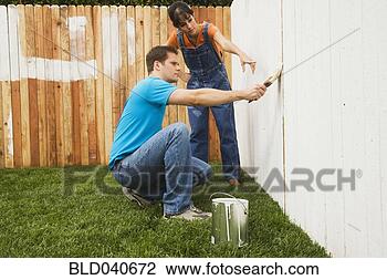 Stock Photo - multi-ethnic couple 
painting fence. 
fotosearch - search 
stock photos, 
pictures, images, 
and photo clipart