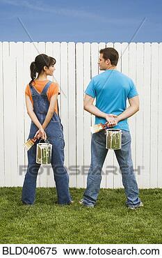 Stock Image - multi-ethnic couple 
painting fence. 
fotosearch - search 
stock photos, 
pictures, images, 
and photo clipart