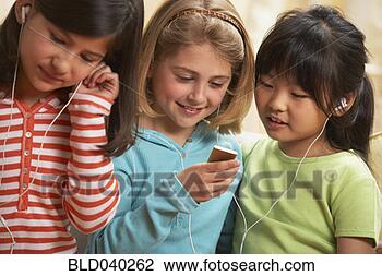 Stock Photo - multi-ethnic girls 
listening to mp3 
players. fotosearch 
- search stock 
photos, pictures, 
images, and photo 
clipart