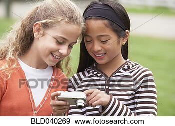 Stock Photograph - multi-ethnic girls 
looking at camera. 
fotosearch - search 
stock photos, 
pictures, images, 
and photo clipart