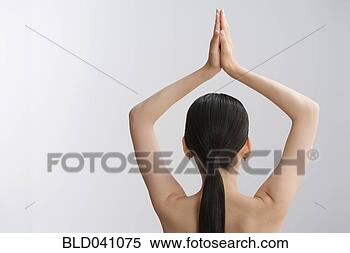 Stock Image - rear view of asian 
woman with hands 
over head. fotosearch 
- search stock 
photos, pictures, 
images, and photo 
clipart