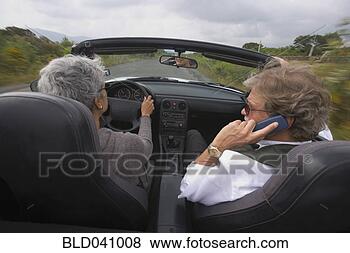 Stock Photo - senior couple 
driving in convertible 
car. fotosearch 
- search stock 
photos, pictures, 
images, and photo 
clipart