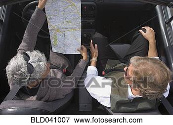 Picture - senior couple 
looking at map 
in car. fotosearch 
- search stock 
photos, pictures, 
images, and photo 
clipart