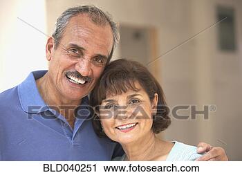 Stock Photography - senior hispanic 
couple hugging. 
fotosearch - search 
stock photos, 
pictures, images, 
and photo clipart