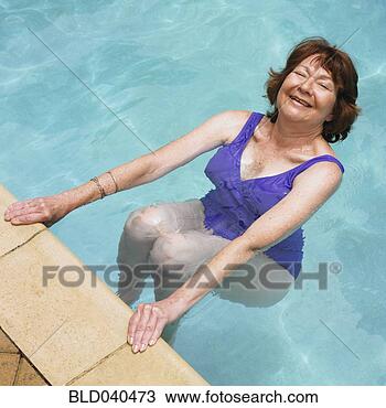 Stock Photo - senior hispanic 
woman in swimming 
pool. fotosearch 
- search stock 
photos, pictures, 
images, and photo 
clipart