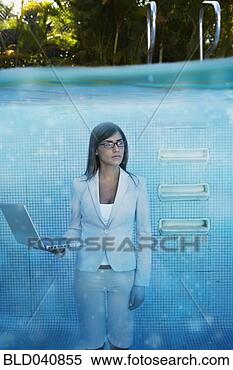 Stock Image - south american 
businesswoman 
in swimming pool. 
fotosearch - search 
stock photos, 
pictures, images, 
and photo clipart