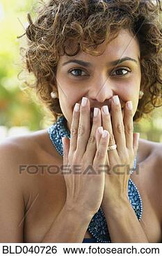 Stock Photo - south american 
woman covering 
mouth. fotosearch 
- search stock 
photos, pictures, 
images, and photo 
clipart