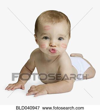 Picture - studio shot of 
baby blowing kiss. 
fotosearch - search 
stock photos, 
pictures, images, 
and photo clipart