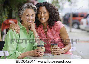 Stock Photography - african american 
mother and adult 
daughter hugging. 
fotosearch - search 
stock photos, 
pictures, images, 
and photo clipart