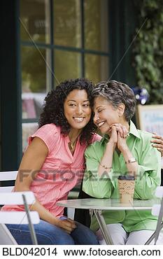 Stock Photo - african american 
mother and adult 
daughter hugging. 
fotosearch - search 
stock photos, 
pictures, images, 
and photo clipart