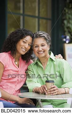 Stock Image - african american 
mother and adult 
daughter hugging. 
fotosearch - search 
stock photos, 
pictures, images, 
and photo clipart