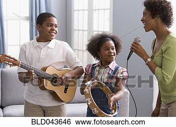 Stock Photo - african american 
mother and children 
playing instruments. 
fotosearch - search 
stock photos, 
pictures, images, 
and photo clipart