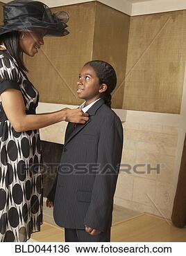 Stock Photo - african mother 
and son dressed 
for church. fotosearch 
- search stock 
photos, pictures, 
images, and photo 
clipart