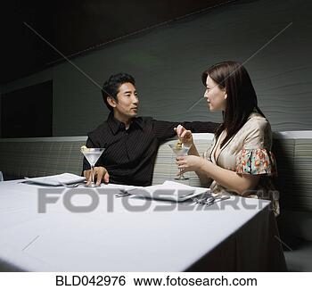 Stock Photo - asian couple drinking 
cocktails. fotosearch 
- search stock 
photos, pictures, 
images, and photo 
clipart