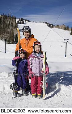 Stock Photo - asian mother and 
daughters in ski 
gear. fotosearch 
- search stock 
photos, pictures, 
images, and photo 
clipart