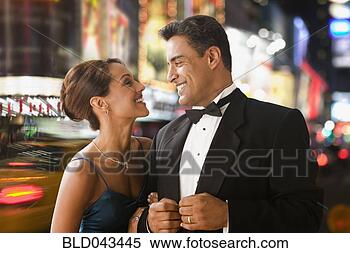 Stock Image - hispanic couple 
in eveningwear 
in urban scene. 
fotosearch - search 
stock photos, 
pictures, images, 
and photo clipart