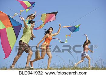 Stock Photo - hispanic family 
flying kites. 
fotosearch - search 
stock photos, 
pictures, images, 
and photo clipart