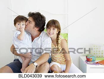 Stock Photograph - hispanic father 
spending time 
with daughters. 
fotosearch - search 
stock photos, 
pictures, images, 
and photo clipart