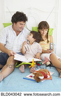 Stock Photo - hispanic father 
spending time 
with children. 
fotosearch - search 
stock photos, 
pictures, images, 
and photo clipart