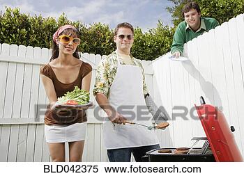 Stock Image - man reaching plate 
over fence at 
barbecue. fotosearch 
- search stock 
photos, pictures, 
images, and photo 
clipart