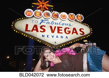 Stock Photo - middle eastern 
woman in front 
of neon sign. 
fotosearch - search 
stock photos, 
pictures, images, 
and photo clipart