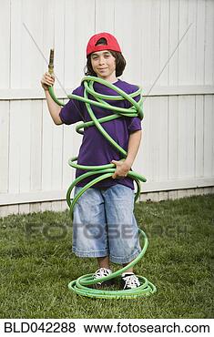 Stock Photo - mixed race boy 
wrapped in garden 
hose. fotosearch 
- search stock 
photos, pictures, 
images, and photo 
clipart