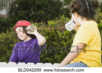 Stock Photograph - mixed race children 
talking with cans 
and string. fotosearch 
- search stock 
photos, pictures, 
images, and photo 
clipart