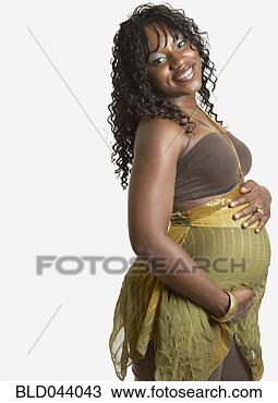 Stock Photo - pregnant african 
american woman 
with hands on 
belly. fotosearch 
- search stock 
photos, pictures, 
images, and photo 
clipart