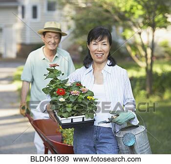 Stock Photograph - senior asian couple 
gardening. fotosearch 
- search stock 
photos, pictures, 
images, and photo 
clipart
