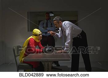 Stock Photograph - super hero being 
interrogated by 
police. fotosearch 
- search stock 
photos, pictures, 
images, and photo 
clipart