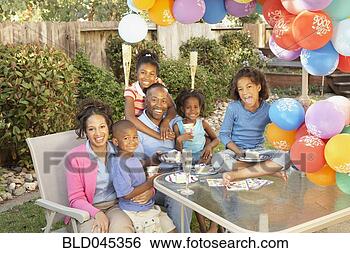 Stock Photo - african american 
family celebrating 
birthday. fotosearch 
- search stock 
photos, pictures, 
images, and photo 
clipart