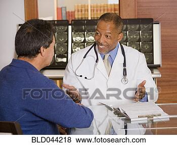 Stock Photo - african american 
male doctor talking 
to patient. fotosearch 
- search stock 
photos, pictures, 
images, and photo 
clipart