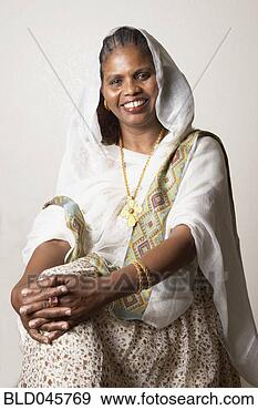 Stock Photograph - african woman 
wearing traditional 
dress. fotosearch 
- search stock 
photos, pictures, 
images, and photo 
clipart