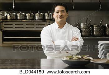 Stock Photograph - asian male chef 
with arms crossed. 
fotosearch - search 
stock photos, 
pictures, images, 
and photo clipart