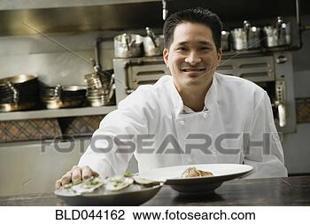 Stock Photo - asian male chef 
in kitchen. fotosearch 
- search stock 
photos, pictures, 
images, and photo 
clipart