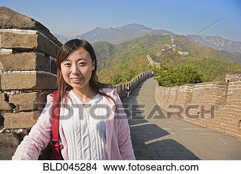 Stock Photo - asian woman on 
great wall of 
china. fotosearch 
- search stock 
photos, pictures, 
images, and photo 
clipart