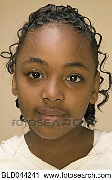 Stock Photography - close up of african 
american girl’s 
face. fotosearch 
- search stock 
photos, pictures, 
images, and photo 
clipart