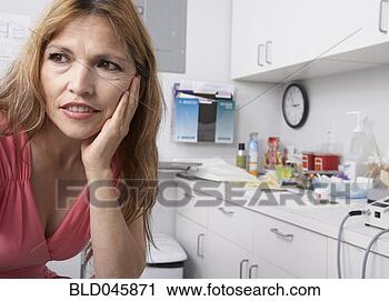 Stock Photography - hispanic woman 
at doctor’s office. 
fotosearch - search 
stock photos, 
pictures, images, 
and photo clipart