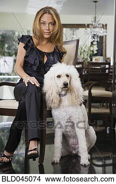 Stock Photo - hispanic woman 
with dog. fotosearch 
- search stock 
photos, pictures, 
images, and photo 
clipart