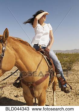 hispanic-woman-riding_~BLD044343.jpg