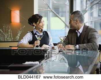 Picture - man and woman 
talking at bar. 
fotosearch - search 
stock photos, 
pictures, images, 
and photo clipart