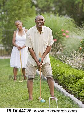 Stock Photo - senior african 
american couple 
playing croquet. 
fotosearch - search 
stock photos, 
pictures, images, 
and photo clipart