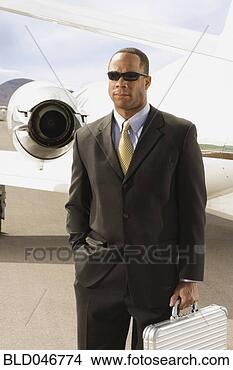Stock Photo - african american 
businessman in 
front of airplane. 
fotosearch - search 
stock photos, 
pictures, images, 
and photo clipart