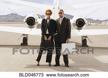 Stock Photo - african american 
businesspeople 
in front of airplane. 
fotosearch - search 
stock photos, 
pictures, images, 
and photo clipart