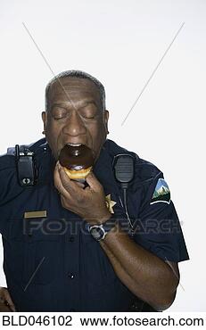 Stock Photo - african american 
male police officer 
eating doughnut. 
fotosearch - search 
stock photos, 
pictures, images, 
and photo clipart