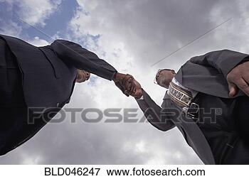 Picture - african businessmen 
shaking hands. 
fotosearch - search 
stock photos, 
pictures, images, 
and photo clipart