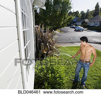 Stock Photography - bare-chested hispanic 
man watering plants. 
fotosearch - search 
stock photos, 
pictures, images, 
and photo clipart