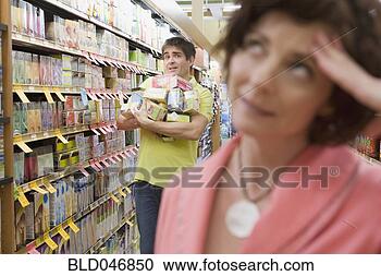 Stock Photography - couple shopping 
at grocery store. 
fotosearch - search 
stock photos, 
pictures, images, 
and photo clipart
